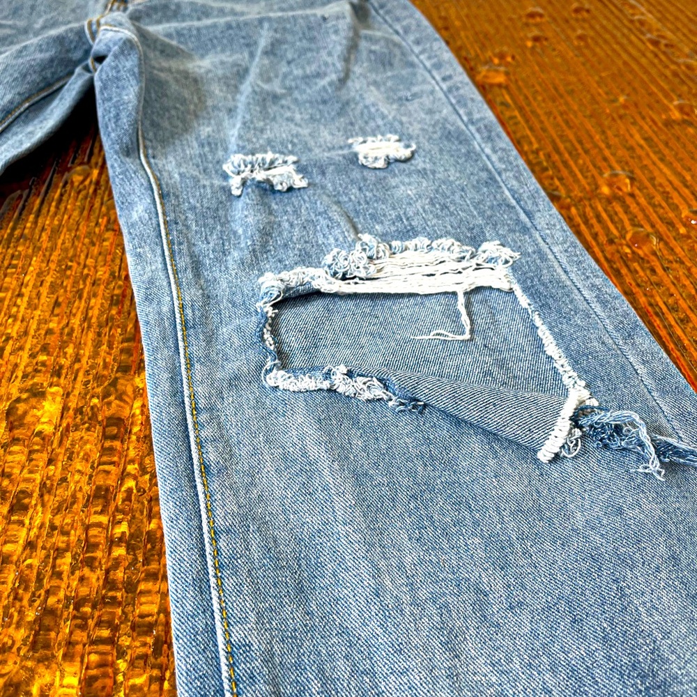 Distress light blue jeans